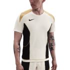 NIKE KM DRI FIT STRIKE SS TOP - PALE IVORY/BLACK/JERSEY GOLD/BLACK