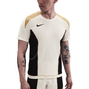 NIKE KM DRI FIT STRIKE SS TOP - PALE IVORY/BLACK/JERSEY GOLD/BLACK